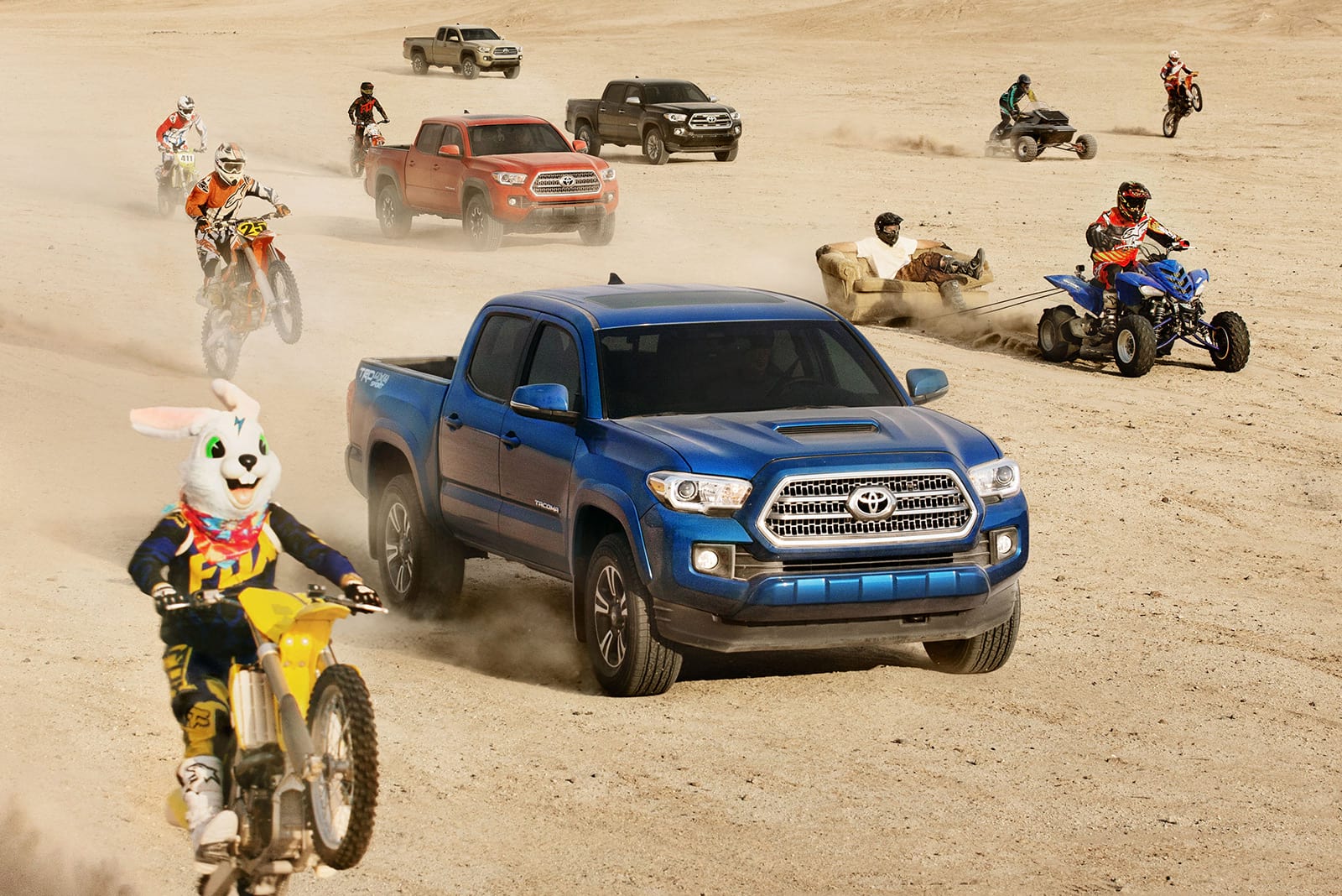 Toyota trucks driving with dirtbikes and ATVs