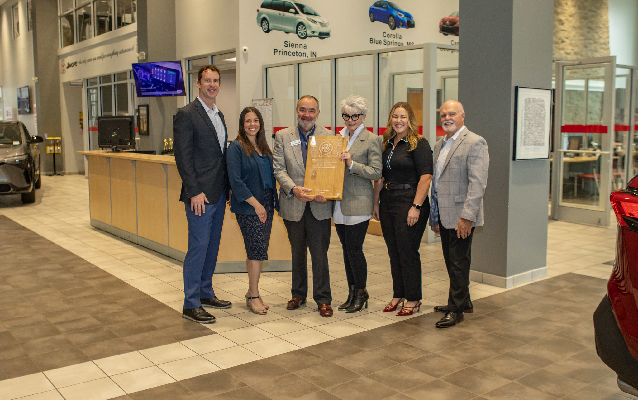 Picture of representatives from Toyota and the Swope dealership in Louisville, KY receiving an award,Picture of representatives from Toyota and the Swope dealership in Louisville, KY receiving an award